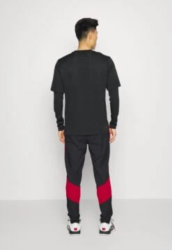 Jordan Woven Pant - Trainingsbroek - Black/Gym Red -ZALANDO WINKEL 1ff506a93f0644fe9f5bef01efff22c5